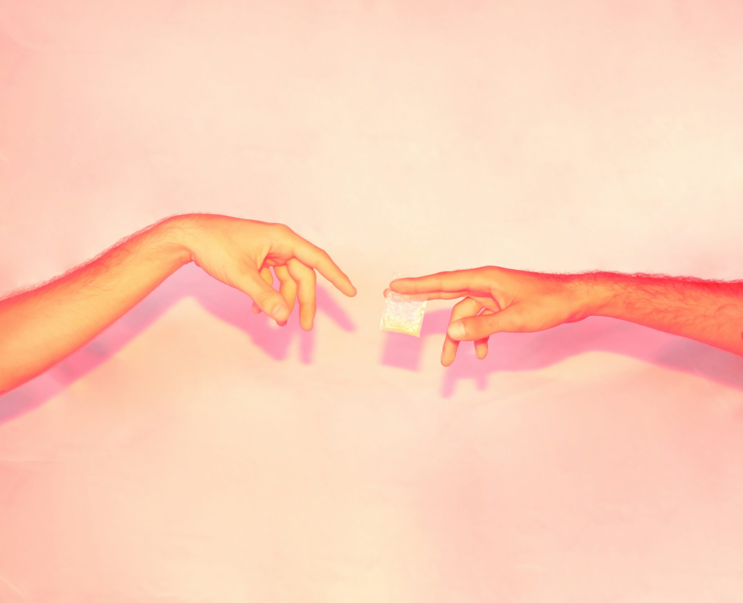 two hands reaching out towards each other